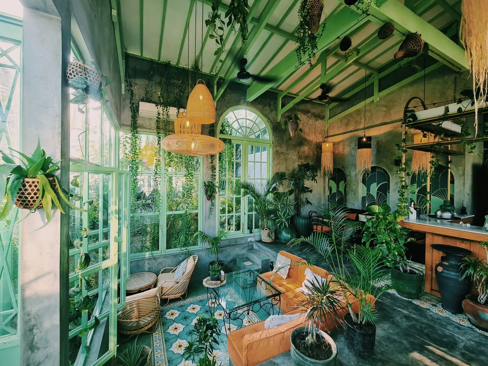 A plant-filled cafe interior of the kind the south-west strip is full of
